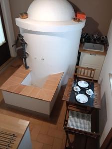 a kitchen with a small table and a sink at Il Casale del Tiglio in Monteleone dʼOrvieto +12 photos