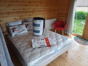 a bed in a room with a mattress and a room at Grand Chêne in Saint-Racho