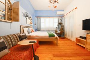 Televiisor ja/või meelelahutuskeskus majutusasutuses Shang Shui Yun Ji B&B