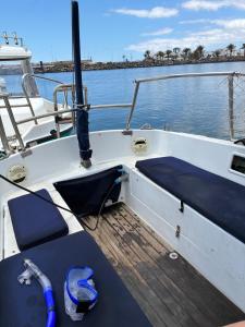 a boat with a bench on the front of the boat at Ulia in Arrecife