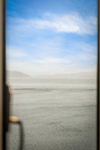 a view of the ocean from a train window at 2026 New built Aparthotel - 5 units - 4BR - 2BR - SKB17 in Bergen