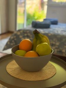 a bowl of fruit sitting on a table at Mont in Rudnik +11 photos