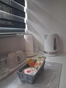 a container of food sitting on a counter next to a window at Apartment Allapera in Svibovec Podravski