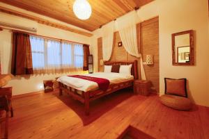Voodi või voodid majutusasutuse Shang Shui Yun Ji B&B toas