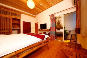 Voodi või voodid majutusasutuse Shang Shui Yun Ji B&B toas