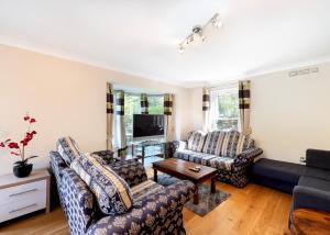 a living room with two couches and a tv at The Clubhouse in Sheffield