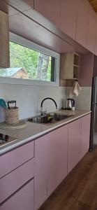 a kitchen with a sink and a window at Kattyjaus in San Carlos de Bariloche