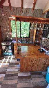 a kitchen with a wooden counter and a sink at Lanco in Lanco