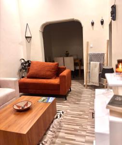 a living room with a couch and a coffee table at Amber Home Kigali in Kigali