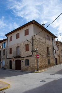a large brick building on the corner of a street at Apartamentos Casa Ferrás in Valderrobres