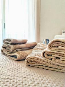 a pile of towels sitting on a bathroom floor at La Steila del Sud in Polignano a Mare +40 photos