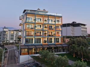 a tall building with a lot of windows at Hotel Porta Ksamil in Ksamil