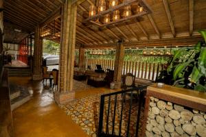 a porch of a house with a car parked in it at Hotel Vísperas in Santa Rosa de Cabal +58 photos