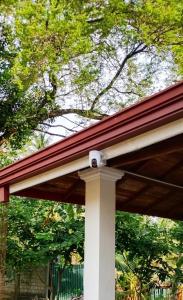 a close up of a porch with a roof at Elegance Cottage in Dagonna +19 photos