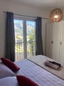 a bedroom with a bed and a large window at Luxury apartment Duće with private pool in Omiš +33 photos