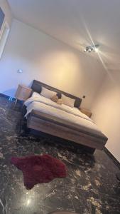 a bedroom with a bed on the floor at My Wellness Ferienwohnung in Bullay +10 photos