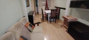 a living room with a couch and a table at Mycoffee Apartment in Mindelo