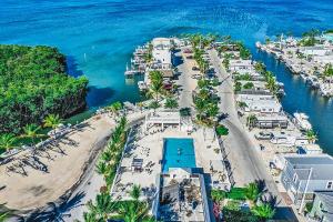an aerial view of a beach with a resort at Happier in the Keys Waterfront Tiny Home in Key Largo