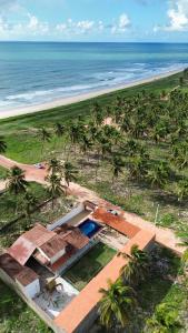 an aerial view of a house next to the beach at Recanto MARES DO SUL in Coruripe