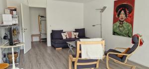 a living room with a couch and a table at Tolle zentrale Wohnung in Engelberg +7 photos