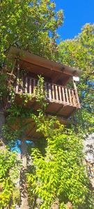 a tree house sitting on top of a tree at TreeHouse in Bar