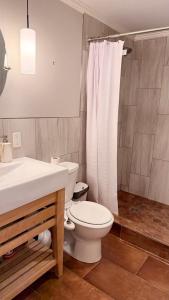 a bathroom with a toilet and a sink and a shower at Private Two Queen Beds Room Near UPEI & Downtown Cozy Retreat Near Everything in Charlottetown
