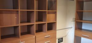 a closet with wooden shelves in a room at Posada Alto Verde in Belén +7 photos