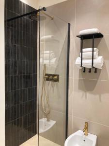 a bathroom with a shower with a toilet and a sink at La Trita Dimore di Charme in Bussi sul Tirino +37 photos