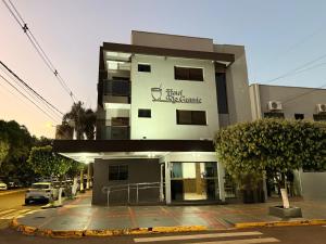 a building with a sign that reads best apartments at Hotel Rio Grande in Dourados