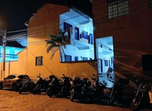 a group of motorcycles parked in front of a building at Pousada Regis Bocaina SJB in São José do Barreiro