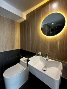 a bathroom with a sink and a toilet and a mirror at Arista - Thanh My Loi in Ho Chi Minh City +90 photos
