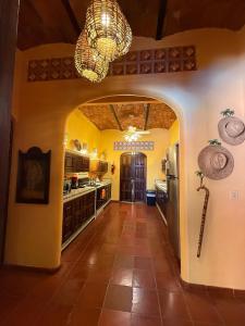a kitchen with an archway in a house at Casa Sorpresa in Sayulita