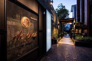 a door to a store with a sign on it at De Chai the Deco Chiang Mai - SHA Plus in Chiang Mai