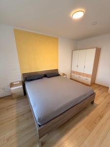 a bedroom with a large bed in a room at Appartement Heidstock in Völklingen