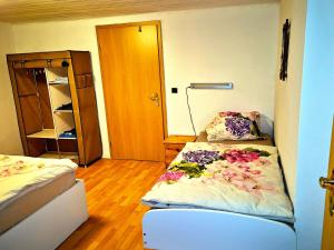 a small room with two beds and a closet at Ferien & Monteure Residence in Schauenburg
