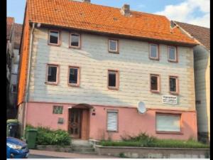 a large house with an orange roof at Ferien & Monteure Residence in Schauenburg