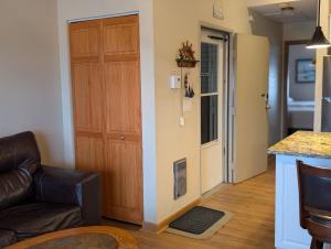 a living room with a door leading to a kitchen at C & D Restawhile in Oak Harbor