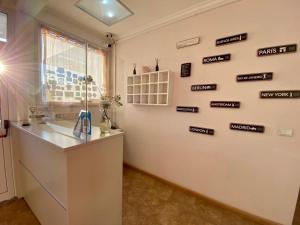 a white room with signs on the wall at KELMAN Hotel in Perito Moreno +38 photos