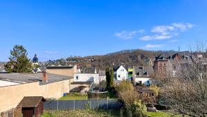 a town with houses and a mountain in the background at PW38 Studio Koblenz in Koblenz