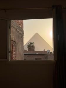 a view of a pyramid from a window at Hur palace pyramids view in Cairo