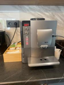 a coffee maker sitting on top of a counter at Villa Una-Adi-Ela in Bihać