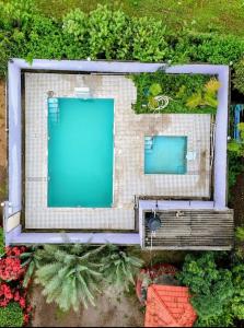 an overhead view of a building with a swimming pool at Mir's Farm House in Hyderabad +7 photos