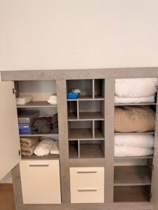 a bunk bed with white drawers and shelves at Appartement Heidstock in Völklingen +14 photos