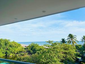 a view of the ocean from a balcony at The Views Resort in El Zonte