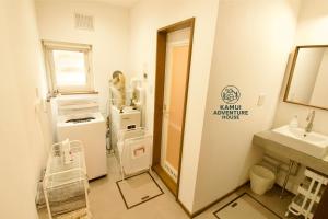 a hospital room with aania appliance institute sign on the wall at Kamui Adventure House in Asahikawa +37 photos