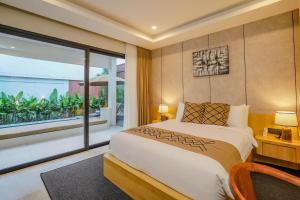 a bedroom with a large bed and a large window at Sanara Oasis Villa in Canggu +150 photos