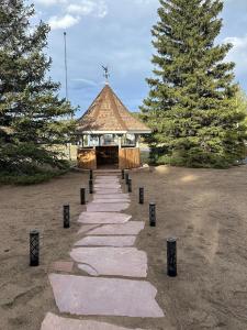 a stone path leading to a gazebo with a cross on top at Columbine Inn in Estes Park +51 photos