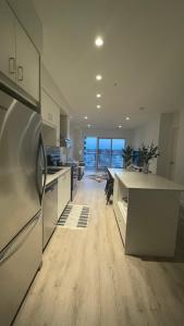 a kitchen with a refrigerator and a counter top at Gaslight in Cambridge