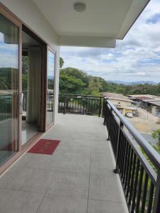 a balcony of a house with a view at Alice Luxury Apartments near Nadi McDonald's in Nadi +72 photos