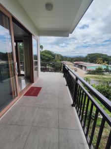 a balcony with a view of the beach at Alice Luxury Apartments near Nadi McDonald's in Nadi